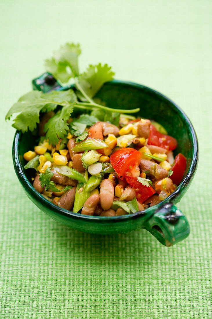 Bean and sweetcorn salad with tomatoes and spring onions