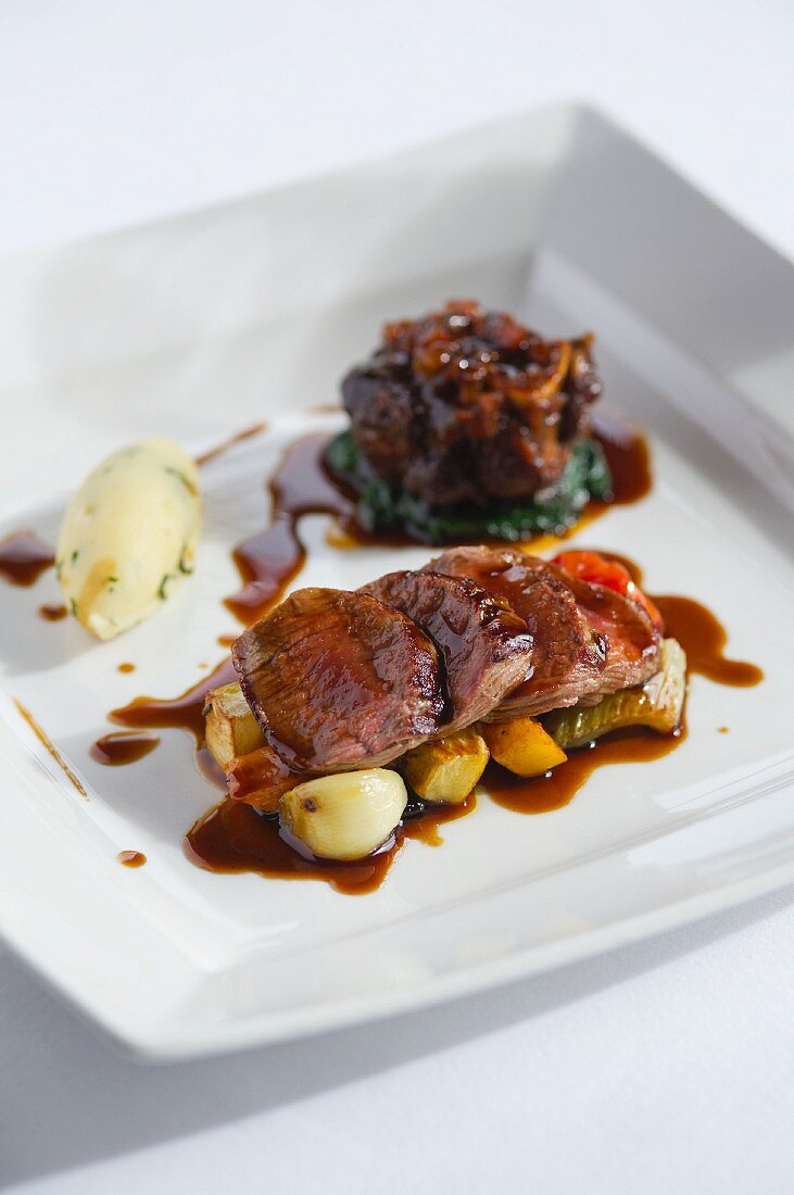 Lamb fillet and ossobuco with a side of vegetables