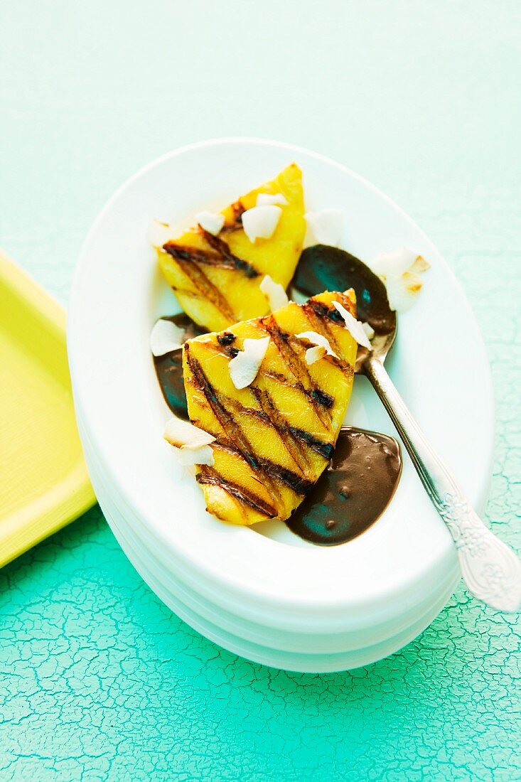 Grilled mango with coconut served with chocolate sauce