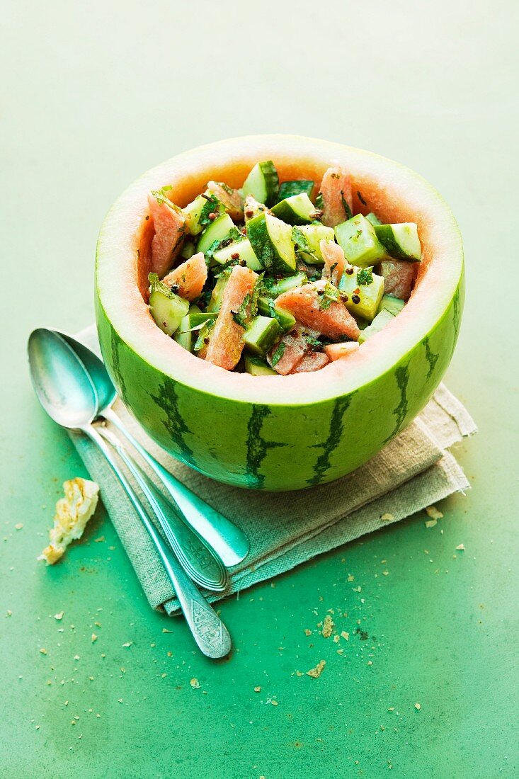 Cucumber and melon salad served in a hollowed out watermelon