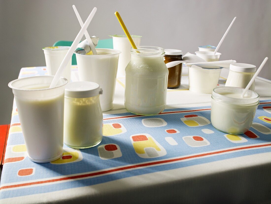 Various yogurts on a kitchen table