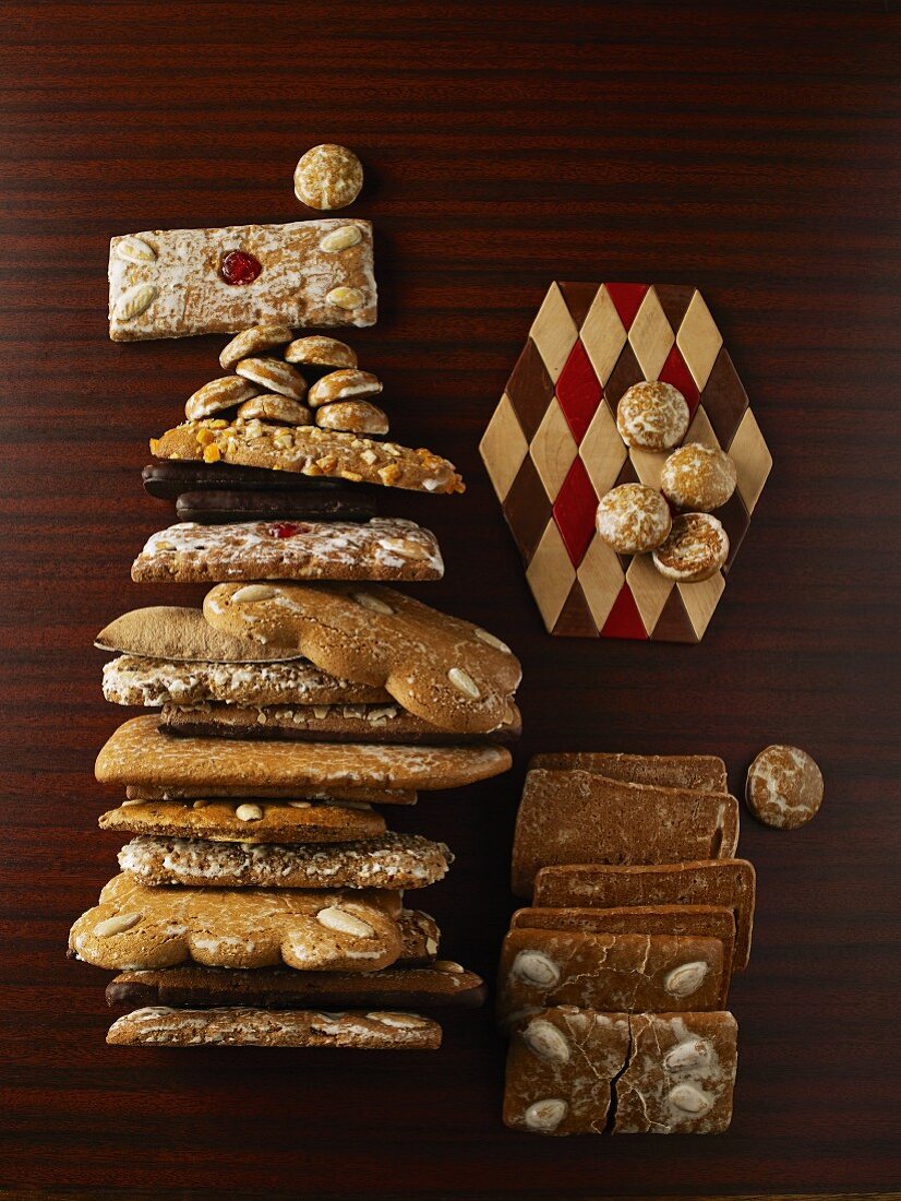 Various types of gingerbread on a wooden table