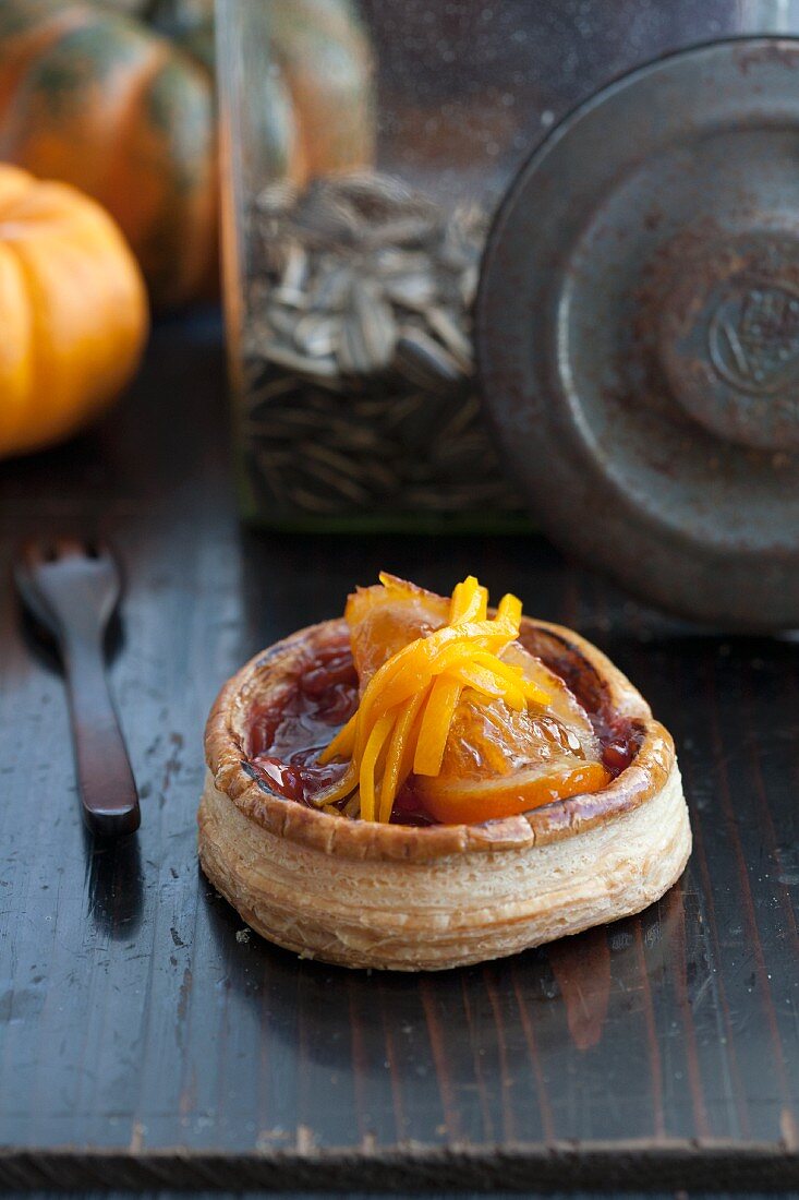 Puff pastry with a aronia jam and candied orange