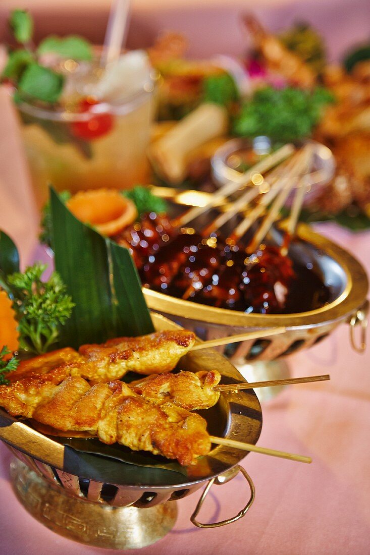 Chicken satay kebabs in a restaurant (Asia)