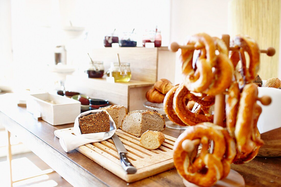 Bread, pretzels and jam on a breakfast buffet