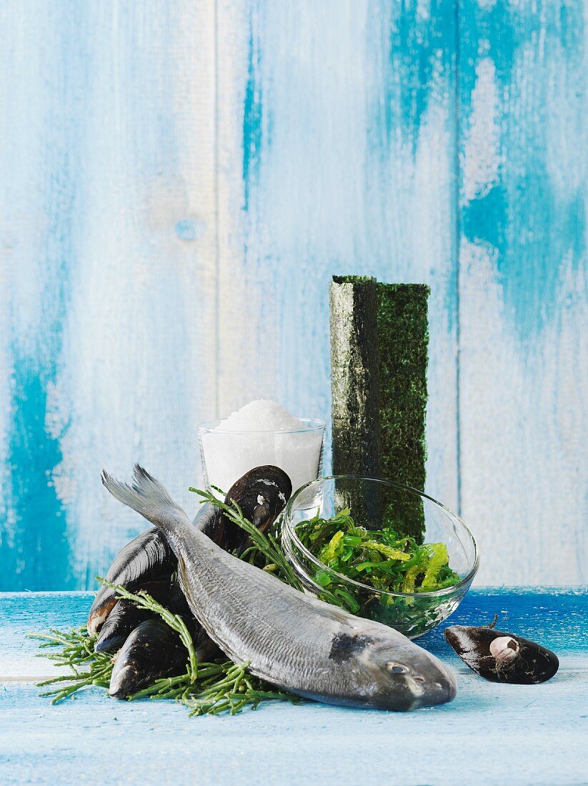 An arrangement of fish, mussels, seaweed and salt