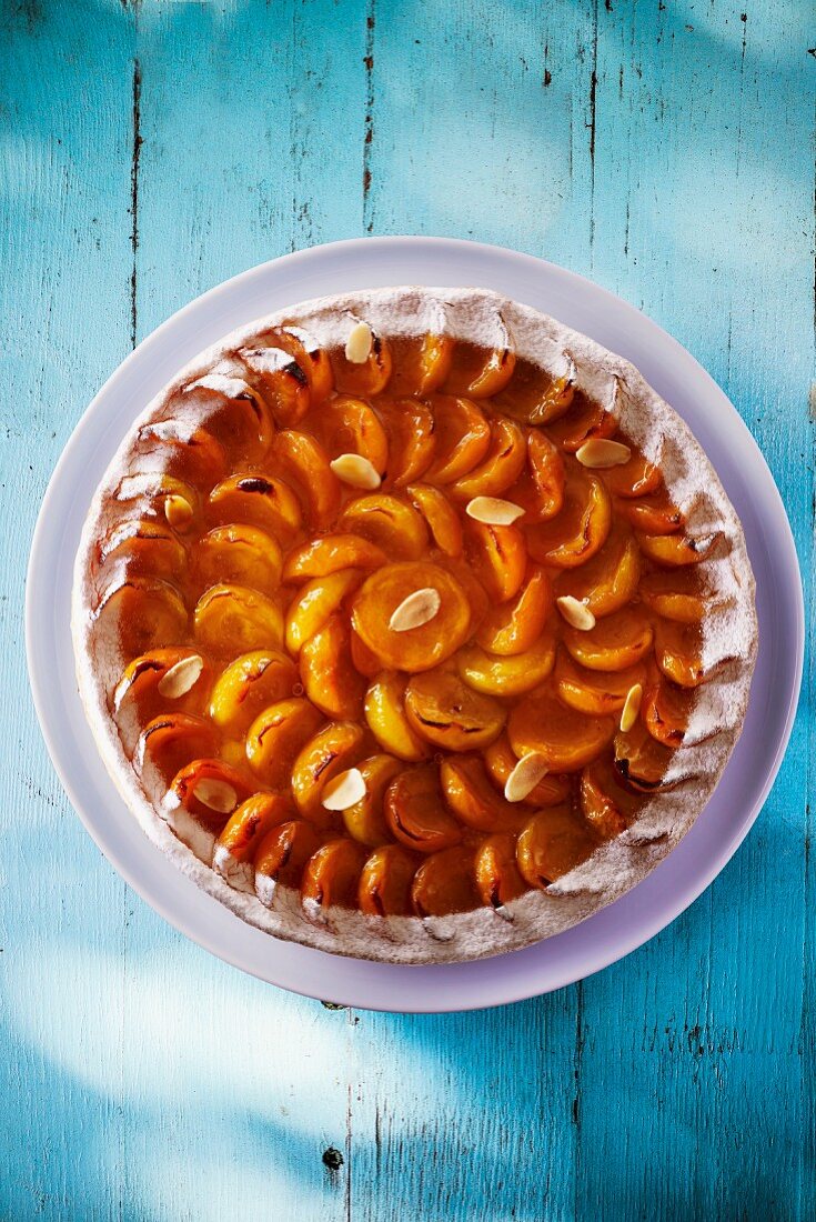 A whole apricot tart with almonds