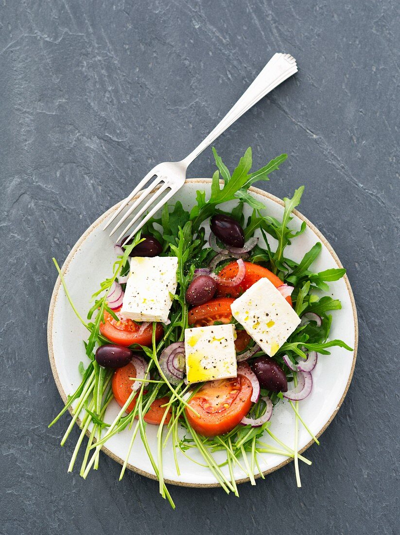 Rocket salad with tomatoes, feta and kalamata olives