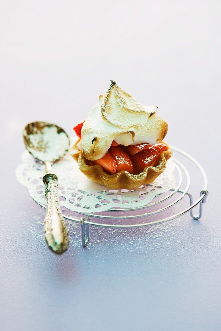 A strawberry tartlet topped meringue