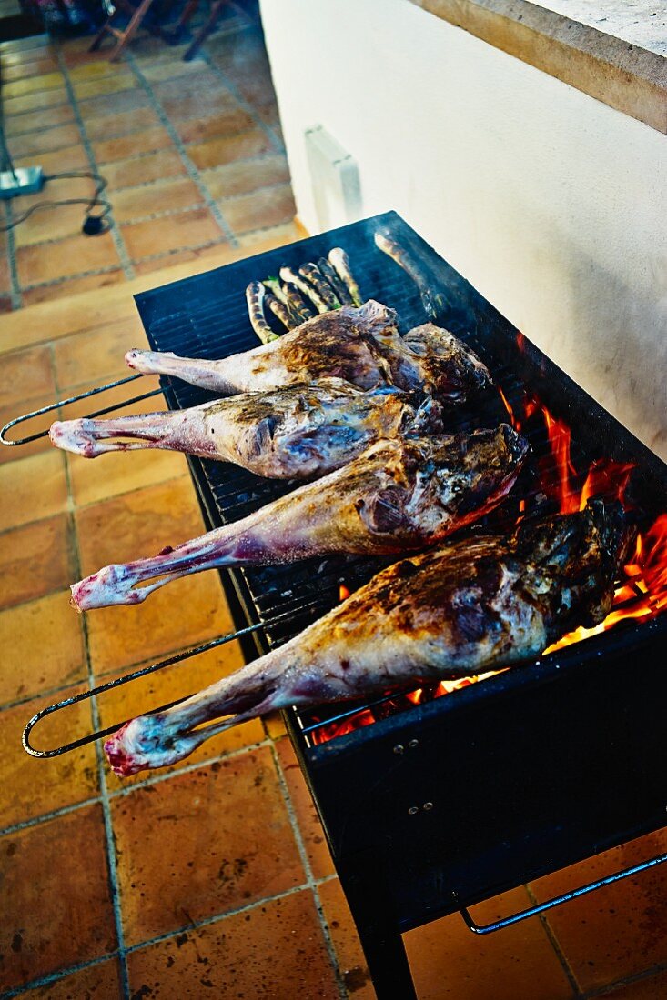 Legs of lamb on a barbecue