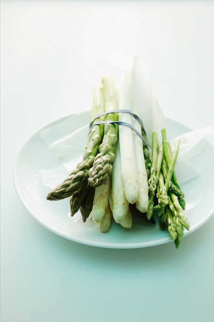 Green and white and wild asparagus bundled together