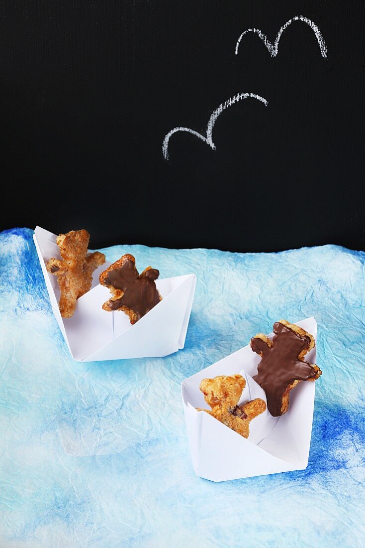 Teddy bear biscuits in paper boats