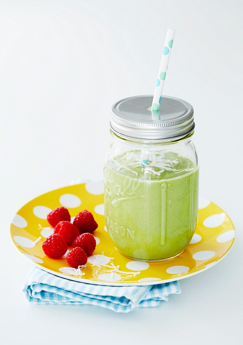 A green smoothie with raspberries