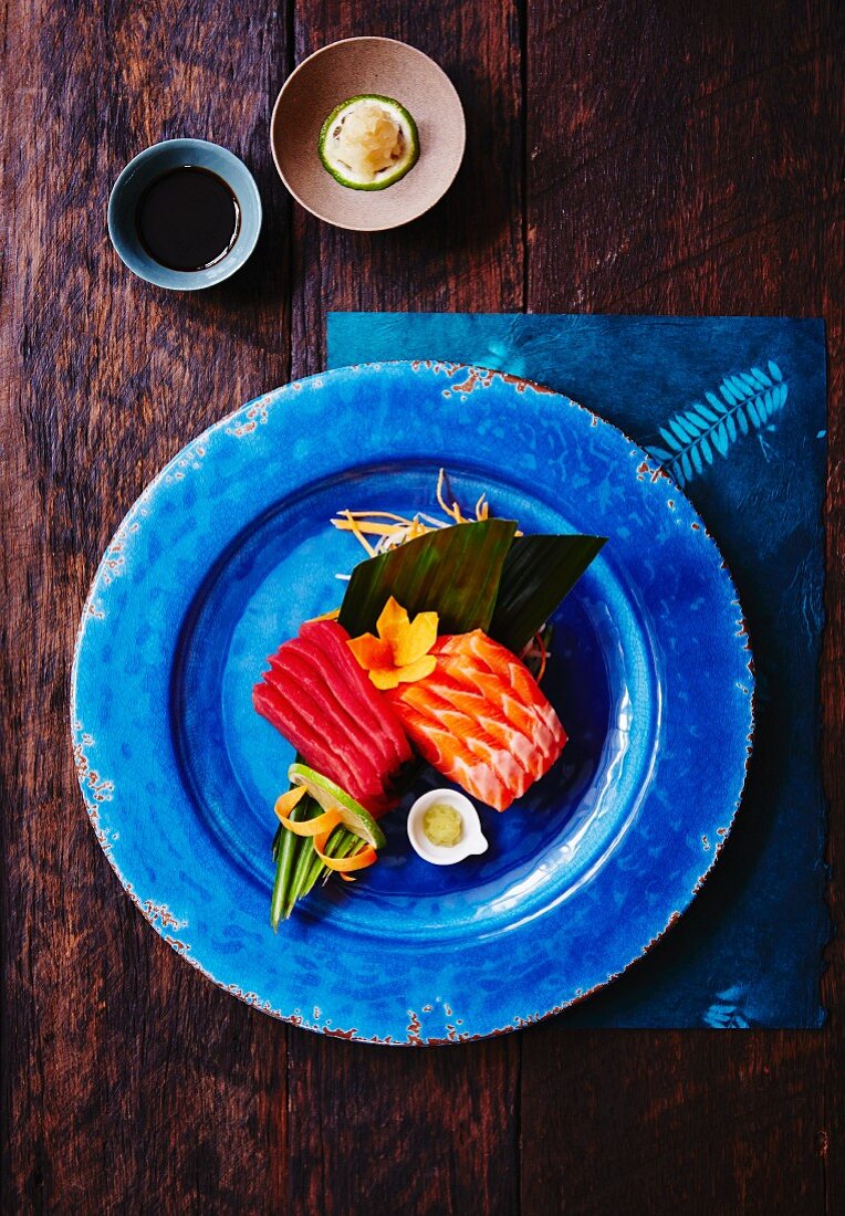 Salmon and tuna sashimi with wasabi and ginger