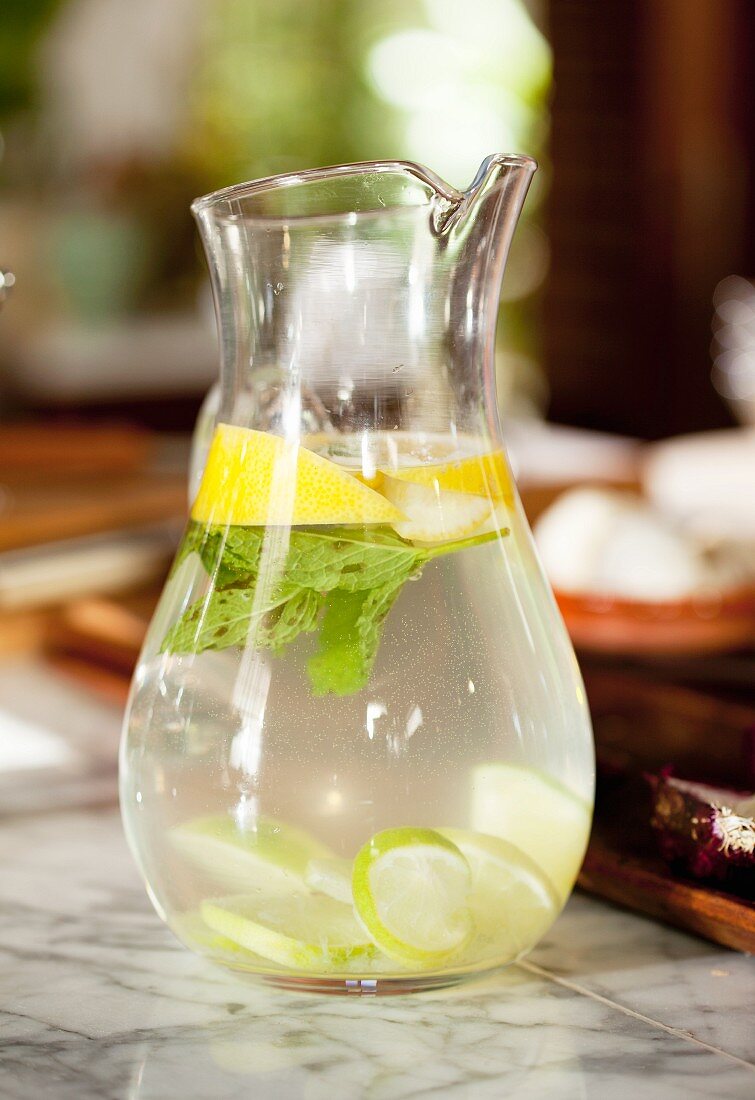 A jug of water with lemon