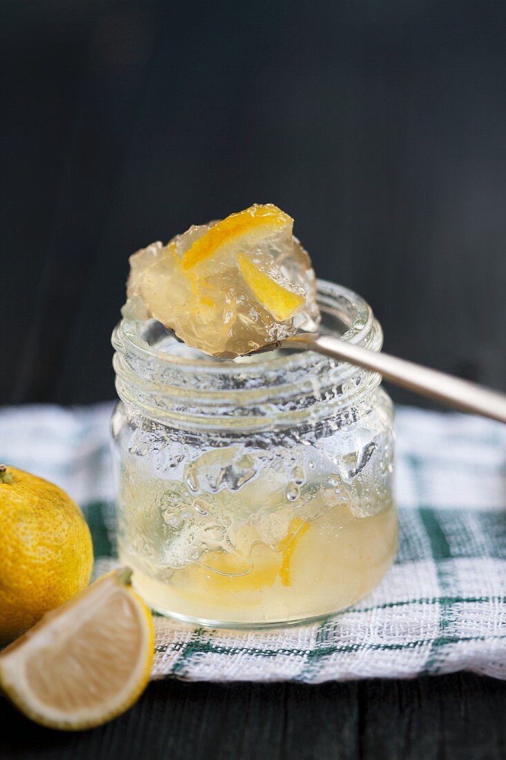 Yuzu jelly in a jam jar and on a spoon