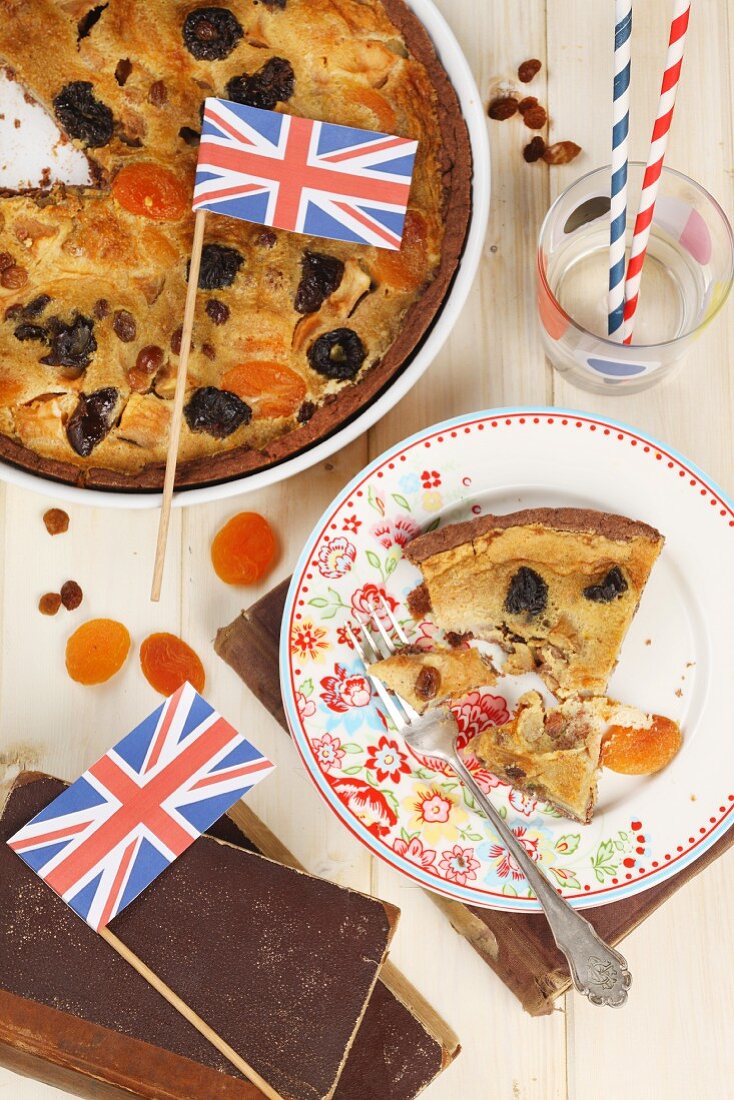 A dried fruit tart decorated with Union Jack flags