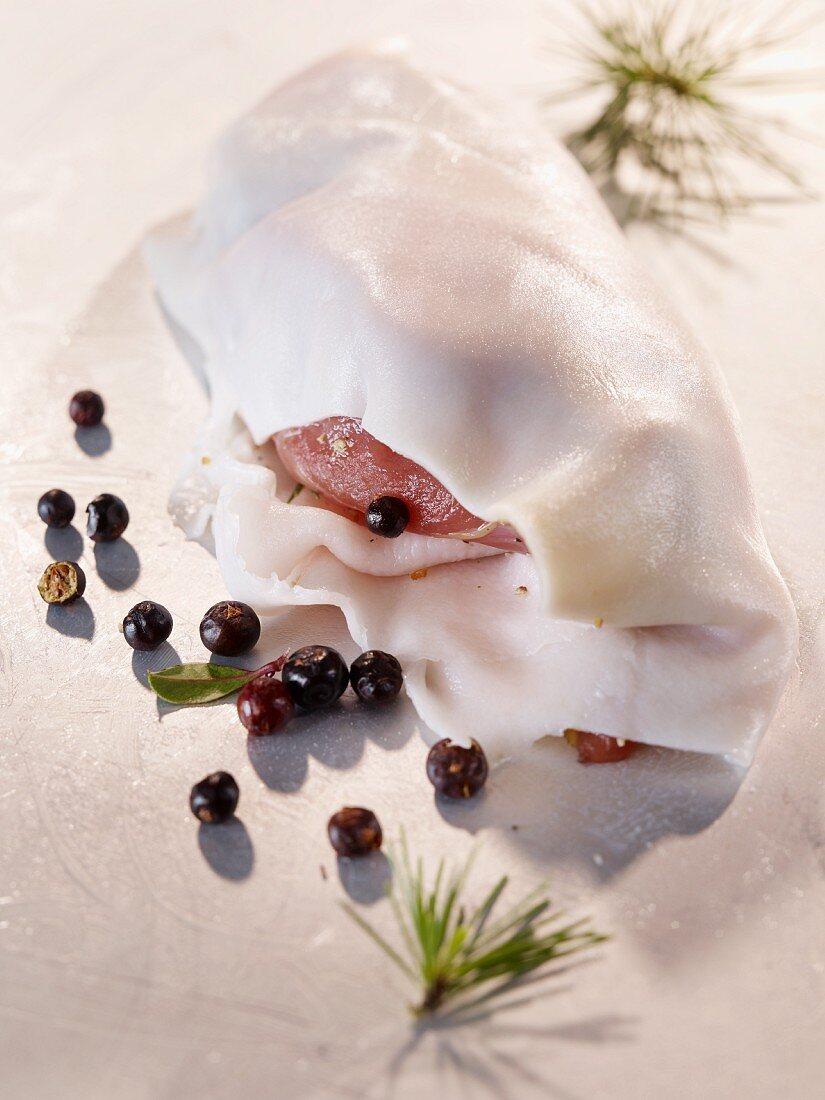 Pheasant wrapped in bacon with juniper berries