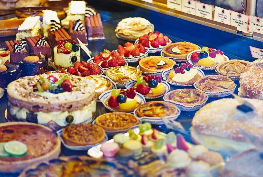 Tartlets and cakes on display in a patisserie (France)