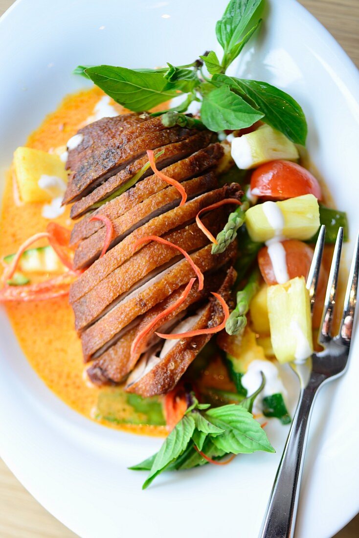 Duck breast with carrot sauce and pineapple (Asia)