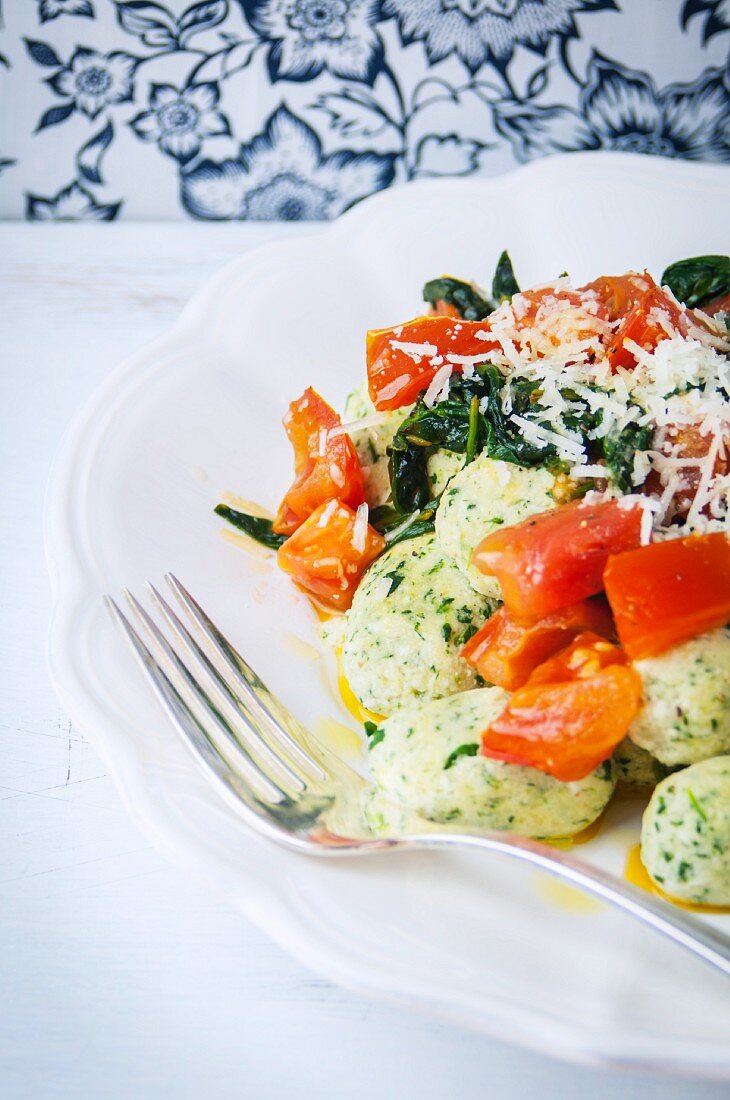 Spinach ricotta gnocchi with a tomato and spinach sauce