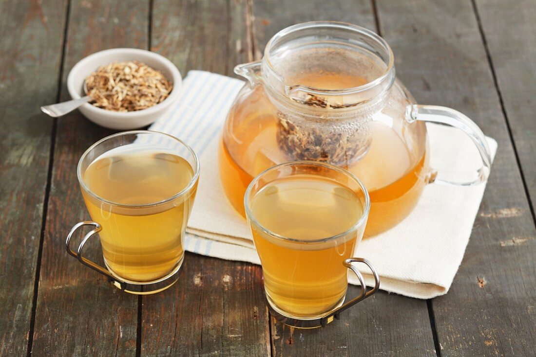 Wheatgrass root tea and dried tea leaves