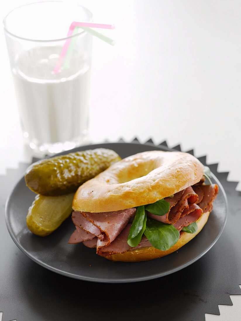 A pastrami and gherkin bagel