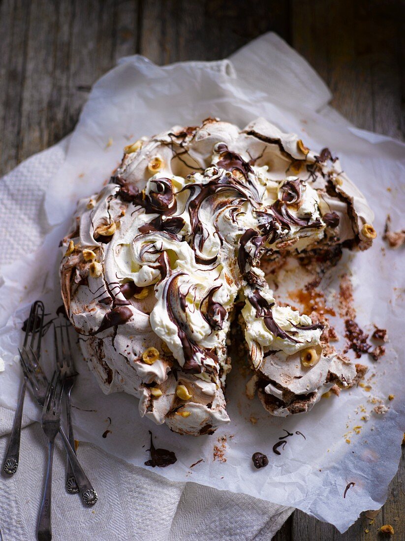 Pavlova with nuts and chocolate, sliced