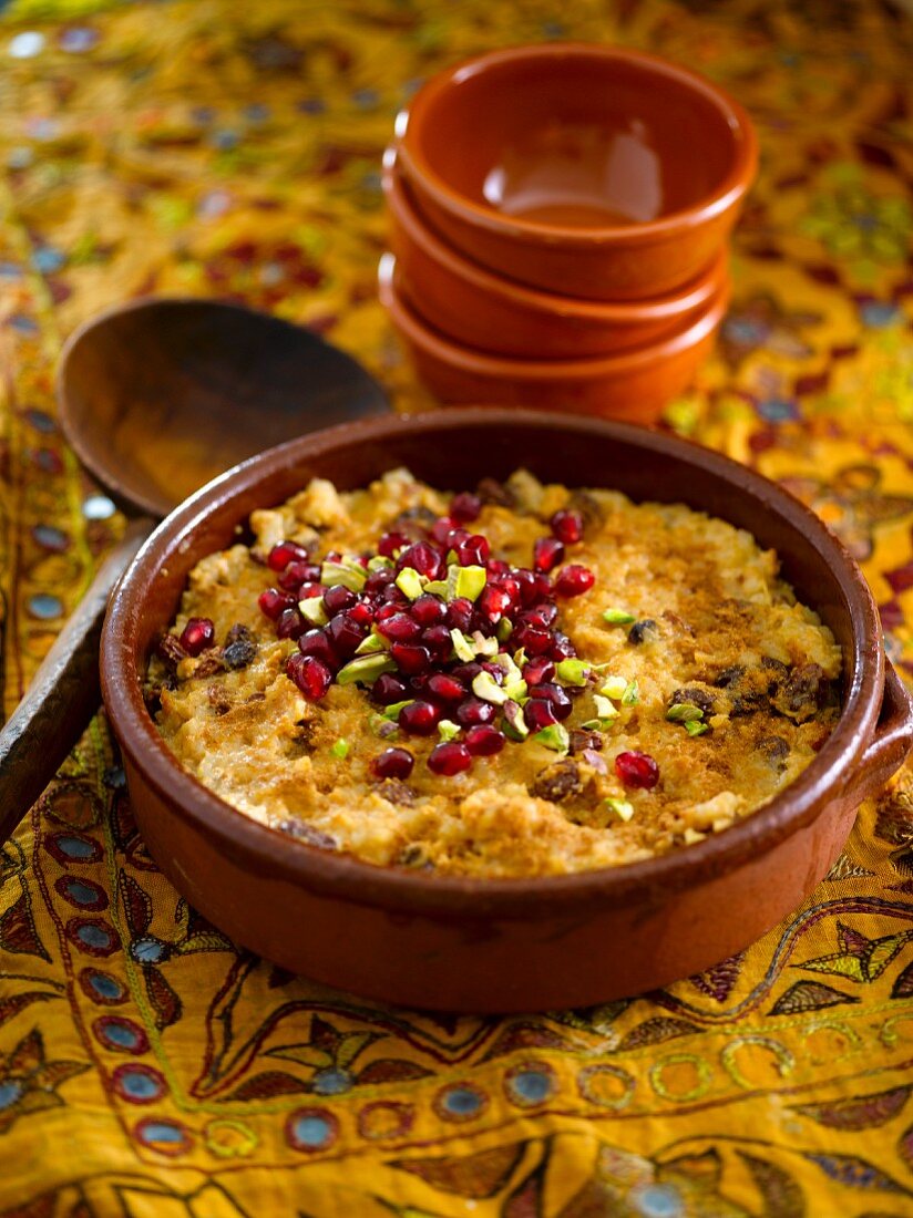 Rice pudding with pistachios and pomegranate seeds