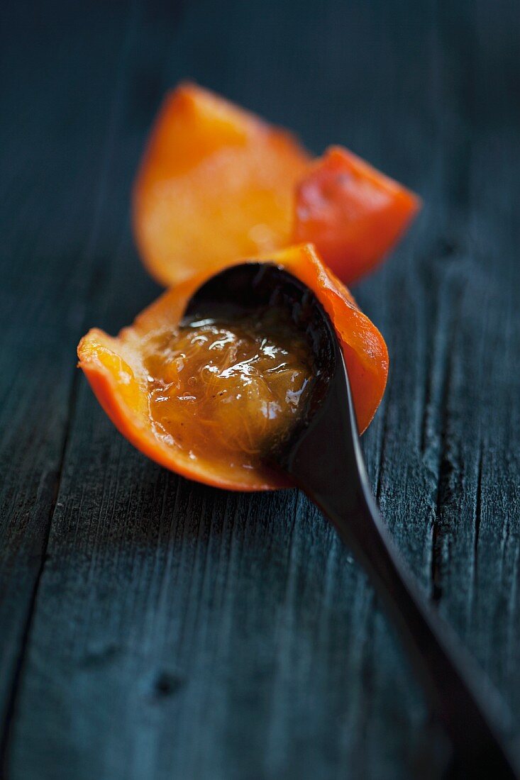 Cold-stirred persimmon jam with a spoon