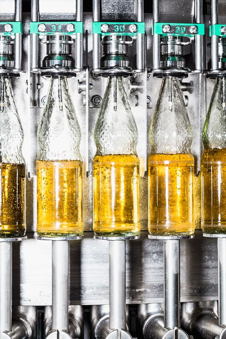 Close up of bottles on a conveyor belt