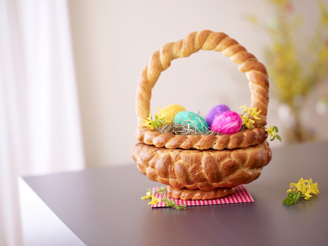 A Easter basket made of bread filled with Easter eggs