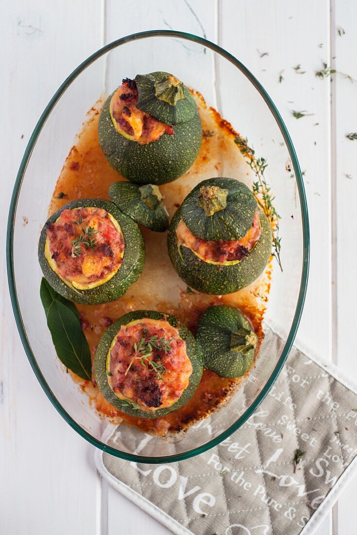 Courgette stuffed with sausages and tomatoes (seen from above)