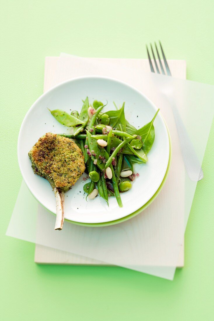 Breaded lamb chops with bean salad