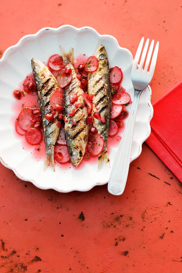 Sweet and sour pickled radishes with grilled sardines