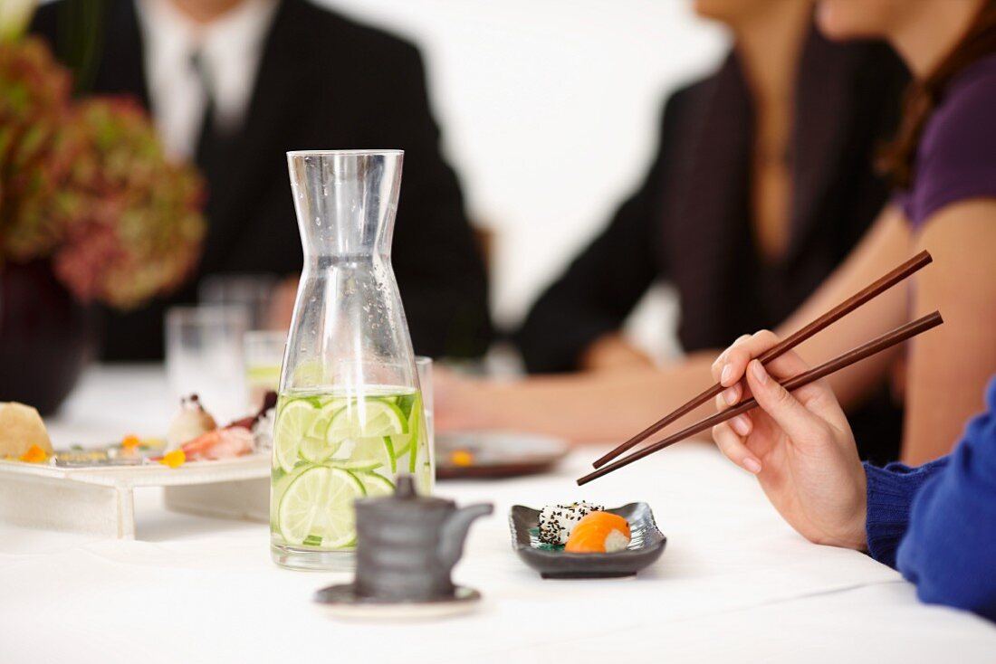 People eating sushi in a restaurant