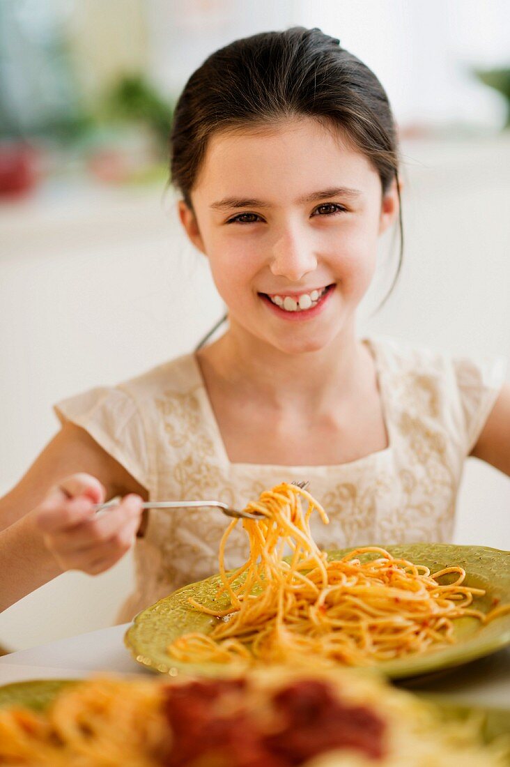 Girl eating spaghetti