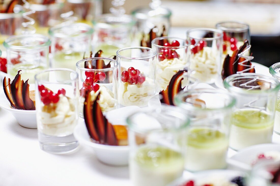 Various creamy desserts on a buffet