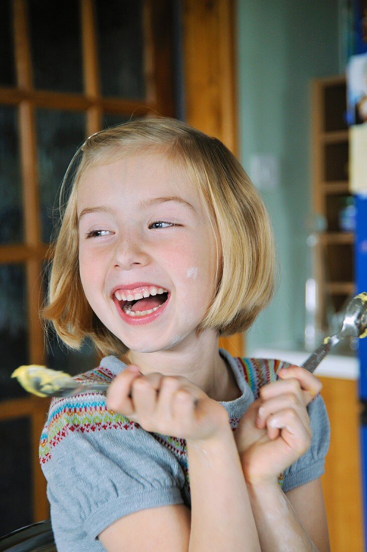 A girl baking in a kitchen