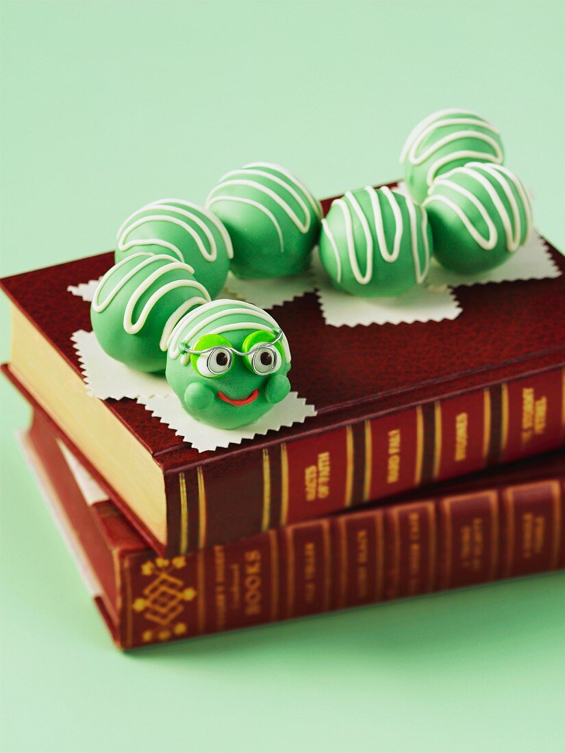 A cake pop bookworm