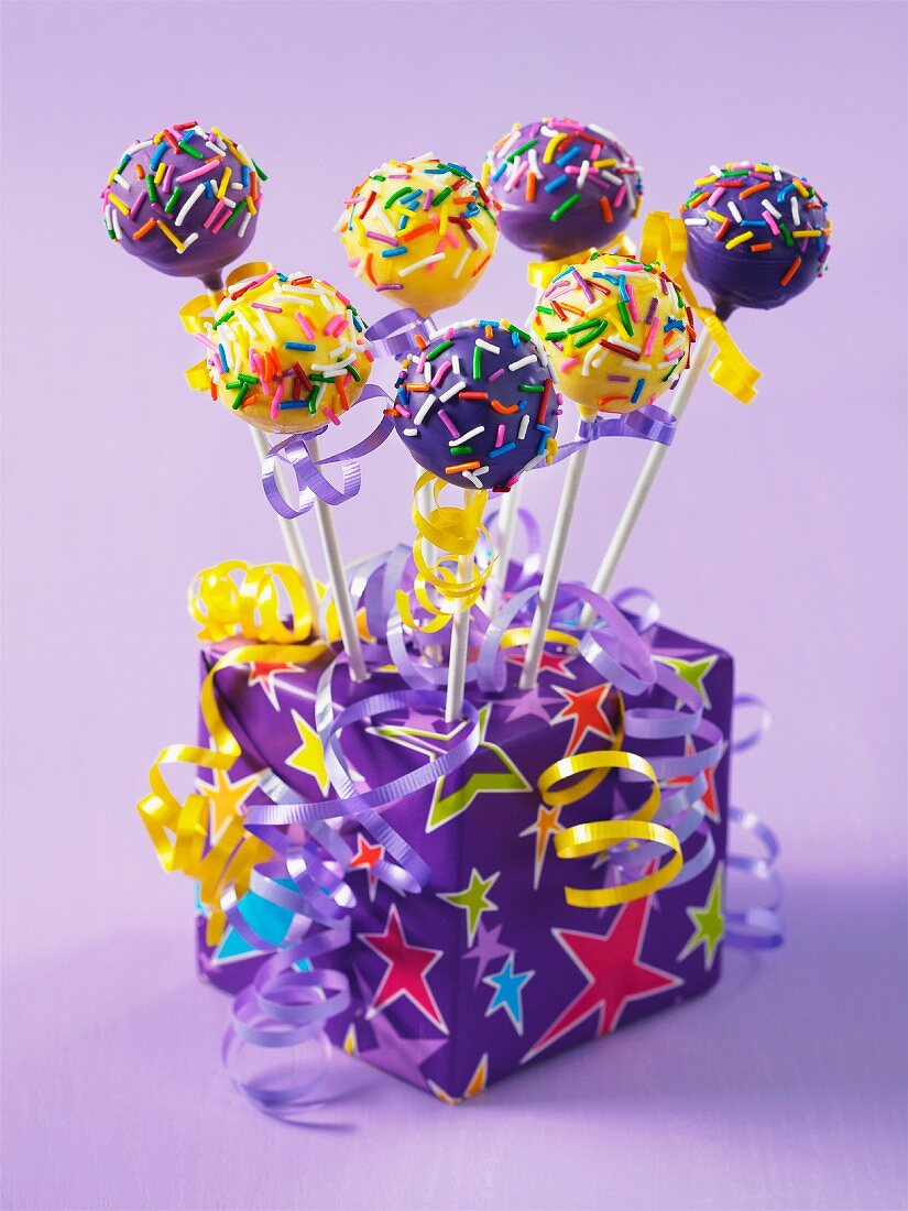 A birthday present decorated with colourful cake pops