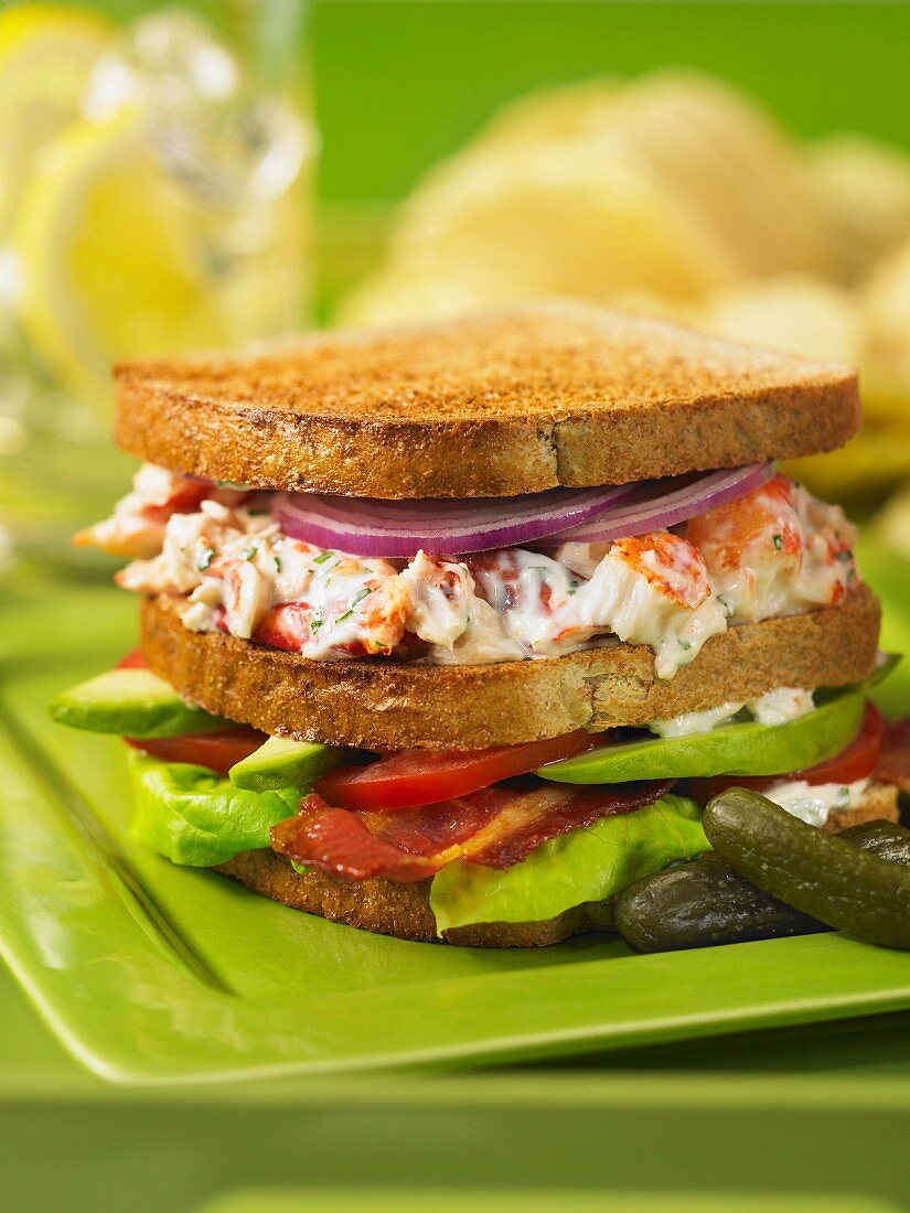 A club sandwich with lobster and avocado