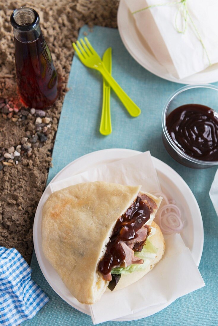 Stuffed pita bread with barbecue sauce for a picnic