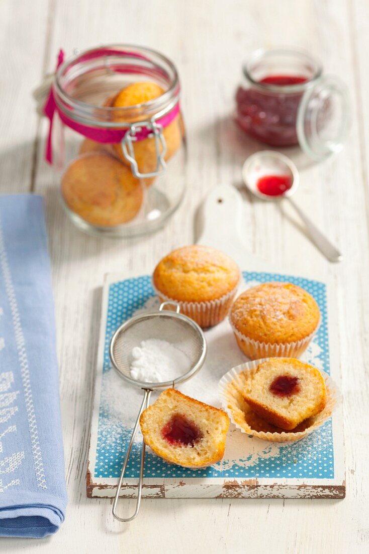 Muffins with cherry jam and icing sugar