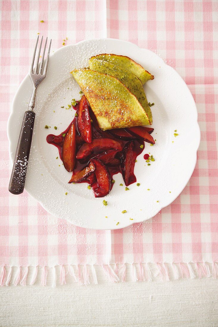 Chopped plums with a pistachio crepe