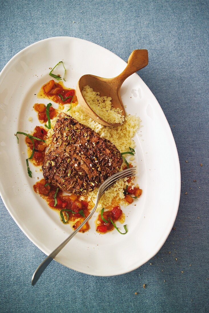 Tuna escalope in a spicy coating with harissa sauce