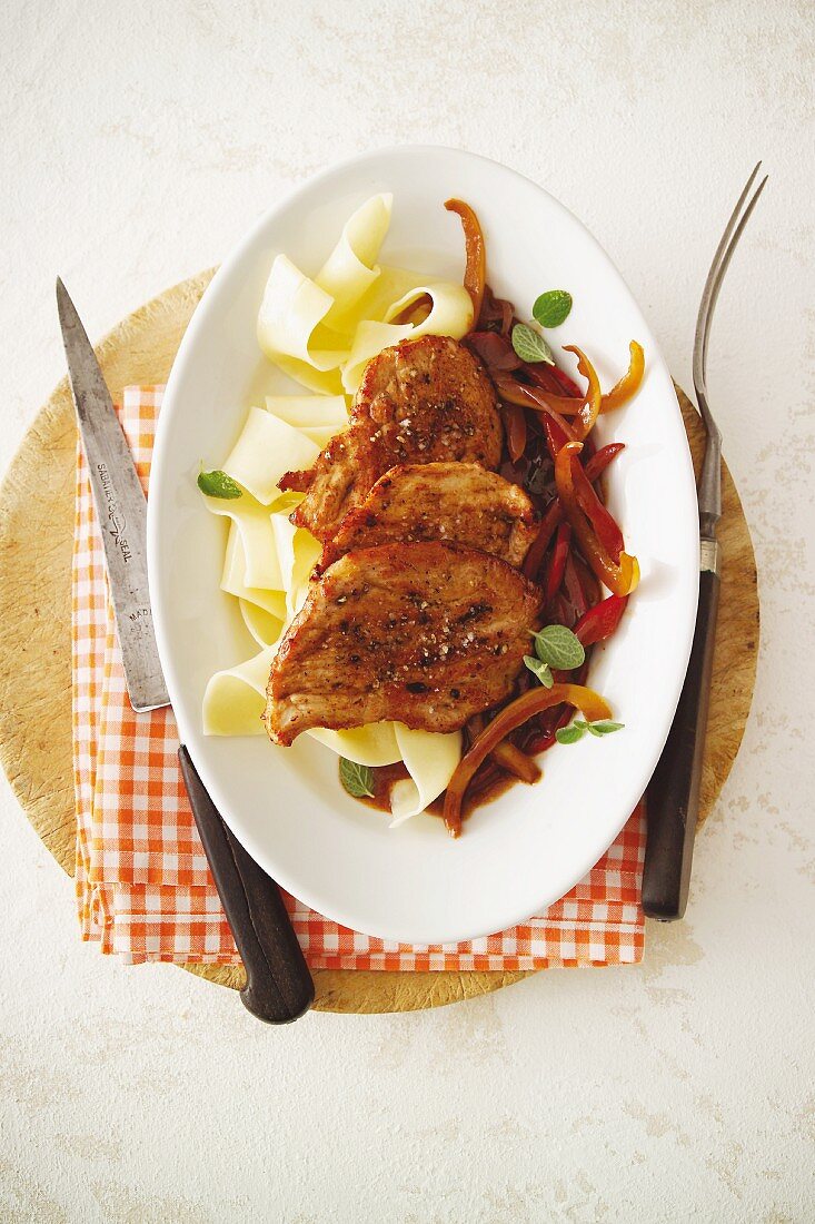 Veal escalope in a spicy pepper sauce served with tagliatelle