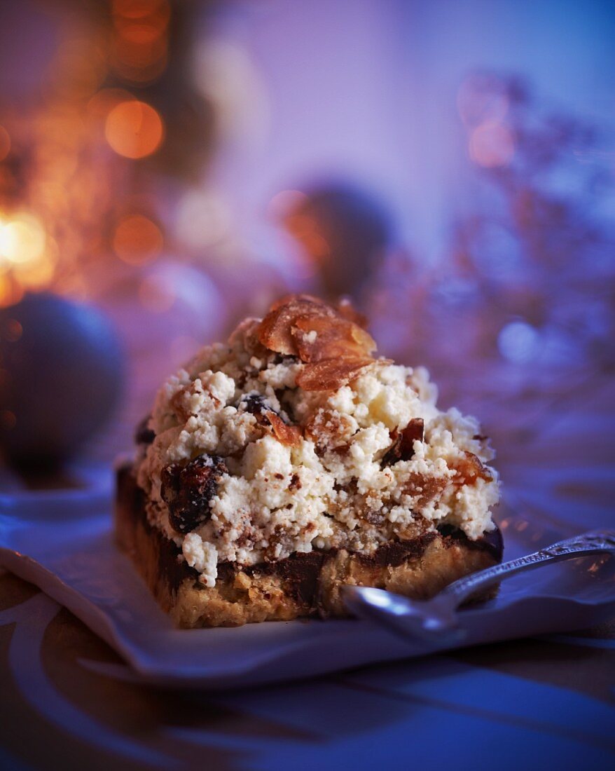 A slice of cheesecake with cranberries and chestnuts