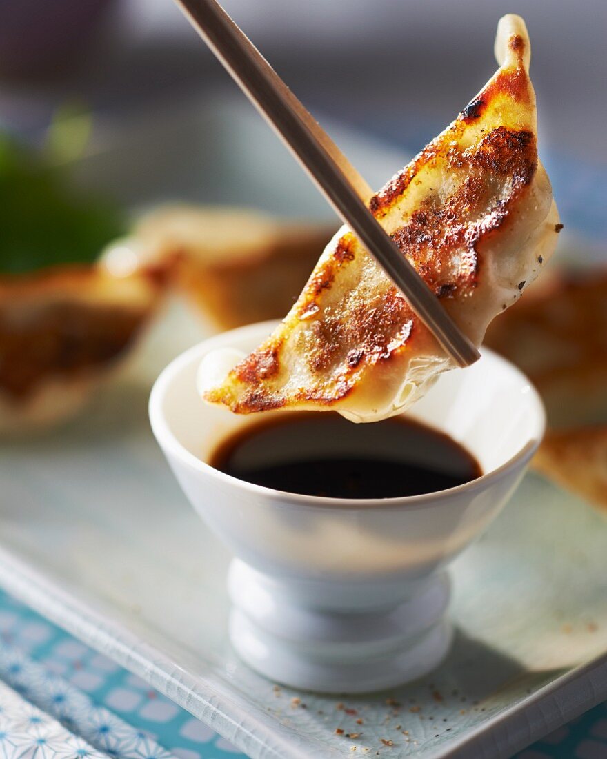Gyoza (Japanese pastry parcels) with soy sauce