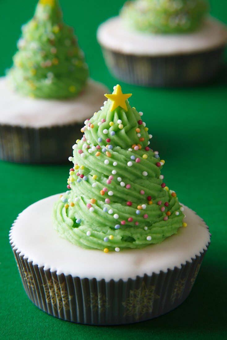 A cupcake decorated to look like a Christmas tree